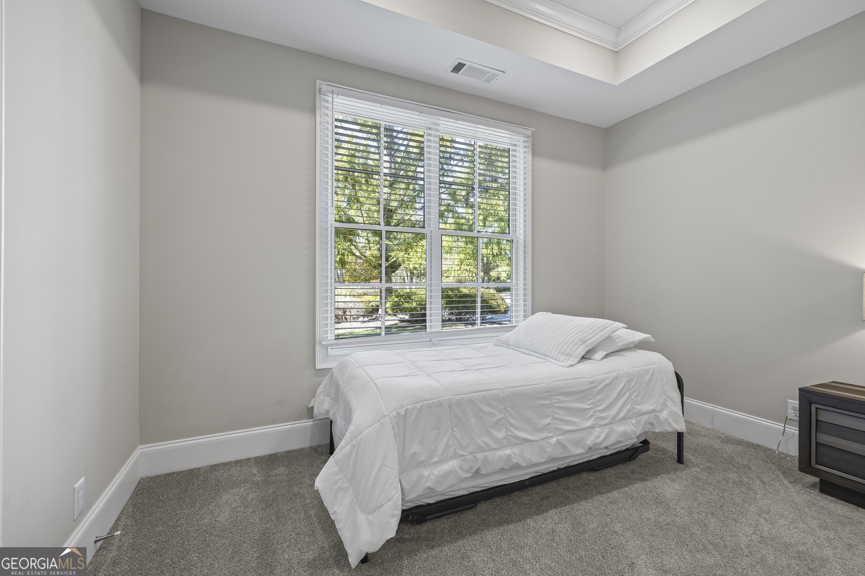 15 Cottage Lane Toccoa, GA 30577 - Photo 33 of 42 a bed sitting in a bedroom next to a window