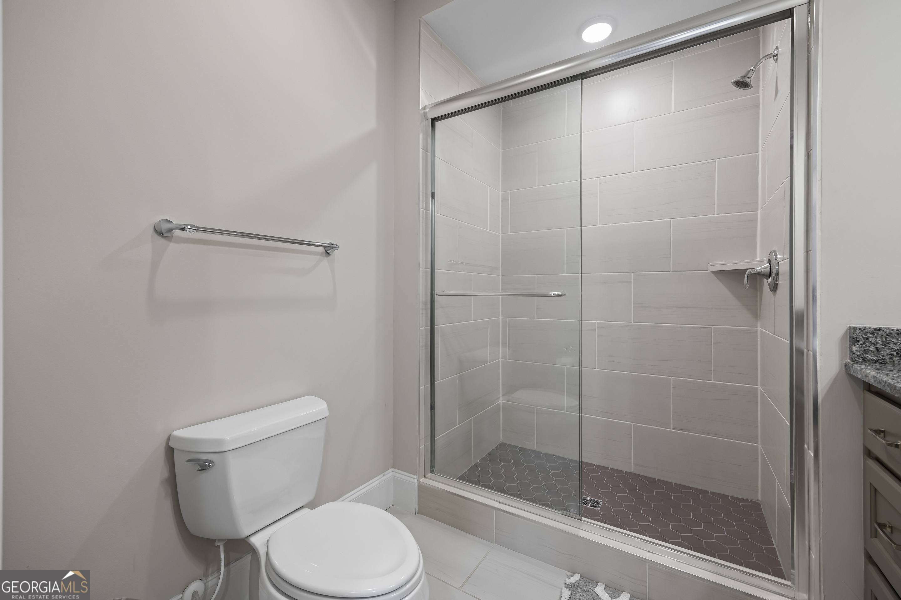 15 Cottage Lane Toccoa, GA 30577 - Photo 34 of 42 a white toilet sitting next to a bathroom shower