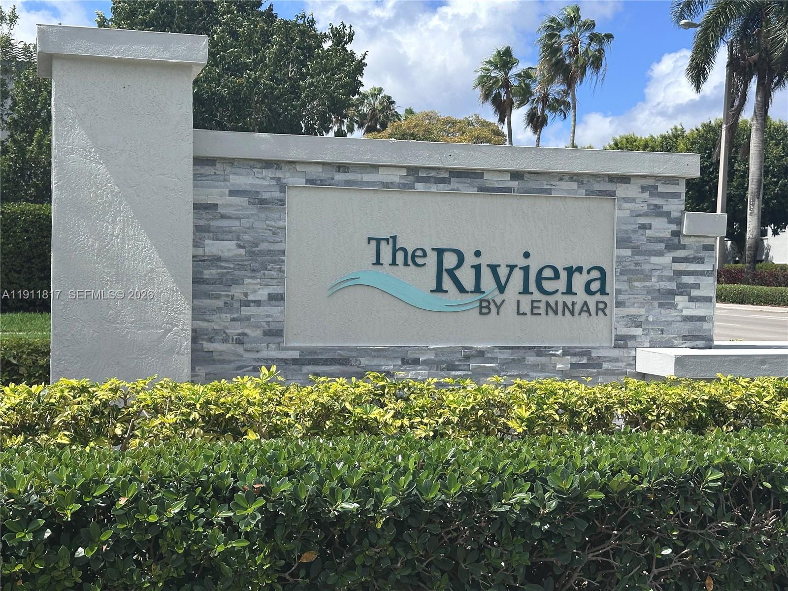a view of a sign under a building