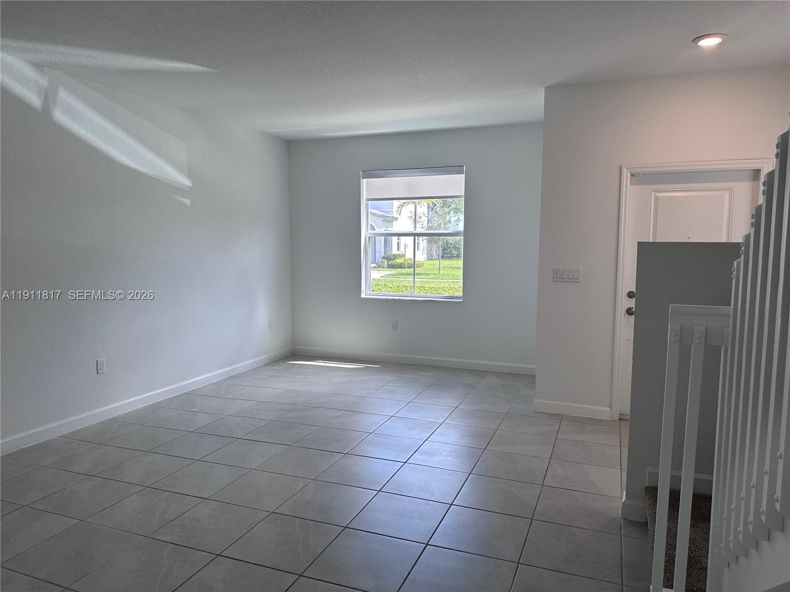 1884 Southeast 27th Street Homestead, FL 33035 - Photo 12 of 34 a view of an empty room with a window