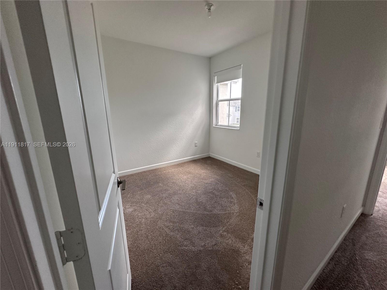 1884 Southeast 27th Street Homestead, FL 33035 - Photo 23 of 34 a view of entryway with window