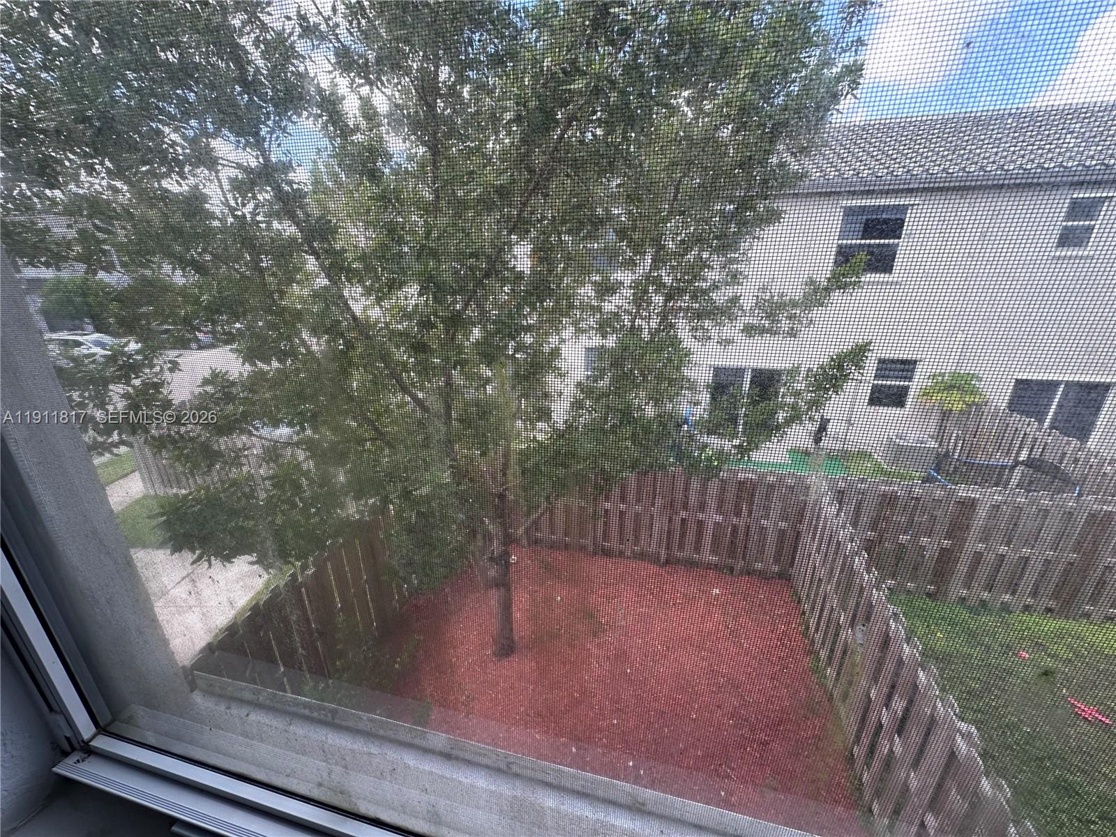 1884 Southeast 27th Street Homestead, FL 33035 - Photo 25 of 34 a view of balcony with wooden floor