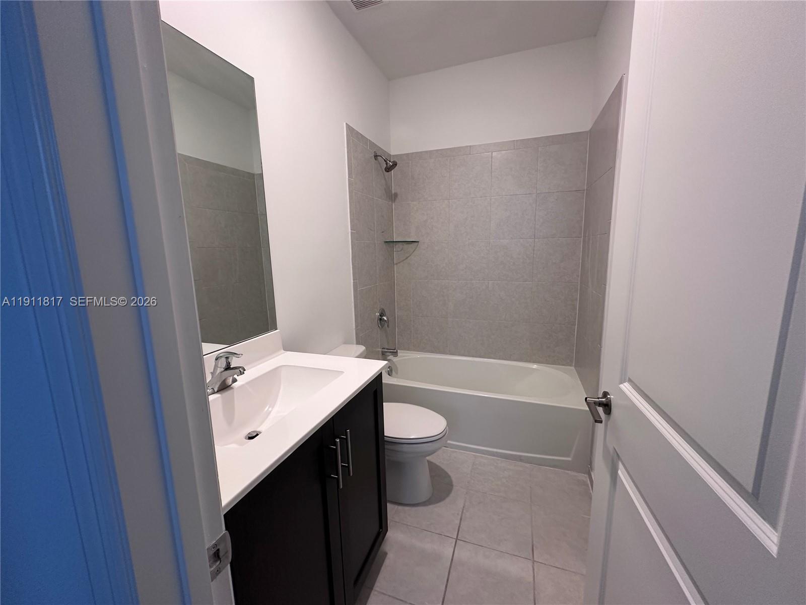1884 Southeast 27th Street Homestead, FL 33035 - Photo 27 of 34 a bathroom with a sink toilet and shower