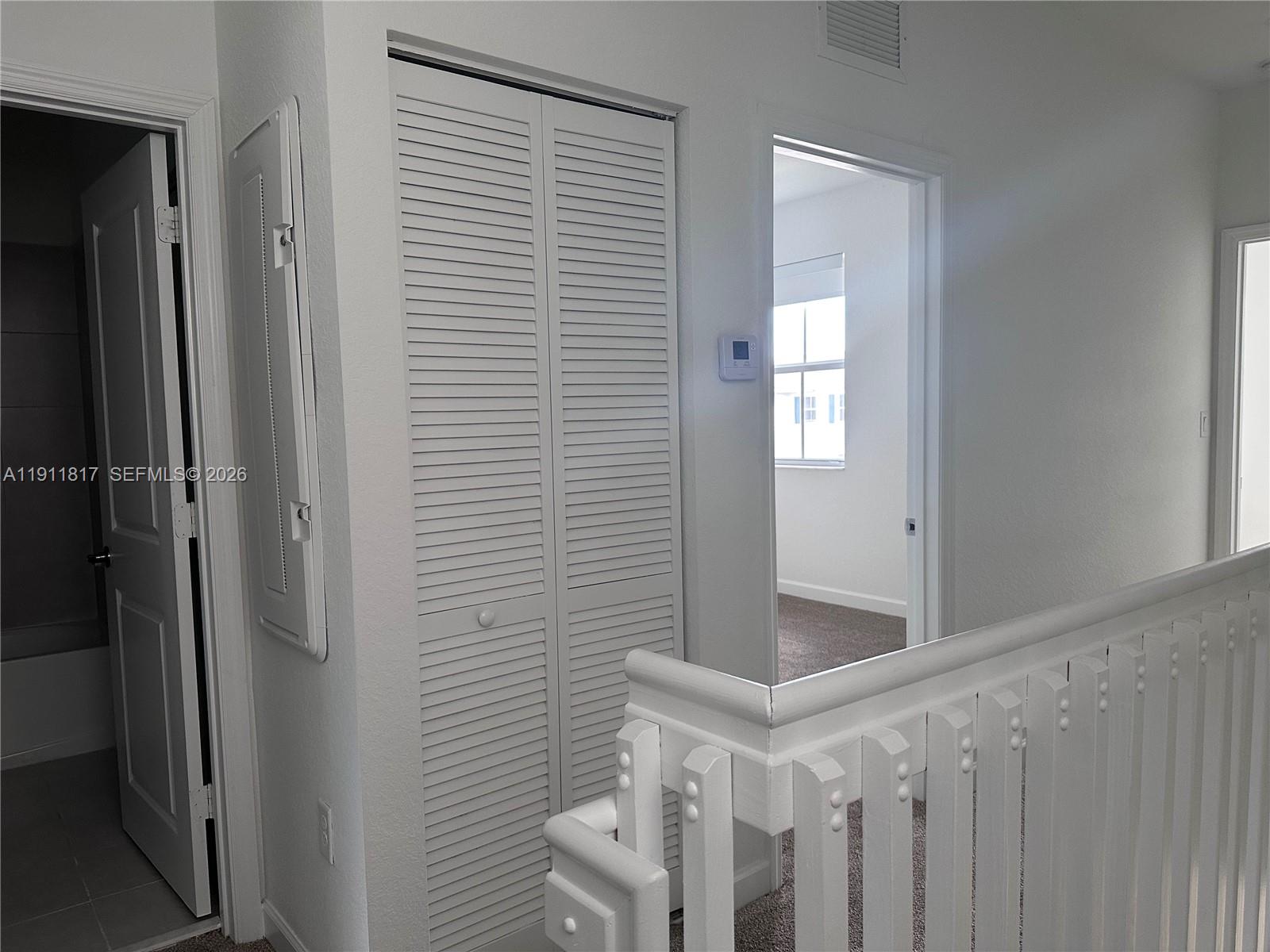 1884 Southeast 27th Street Homestead, FL 33035 - Photo 31 of 34 a view of entryway and hall with wooden floor