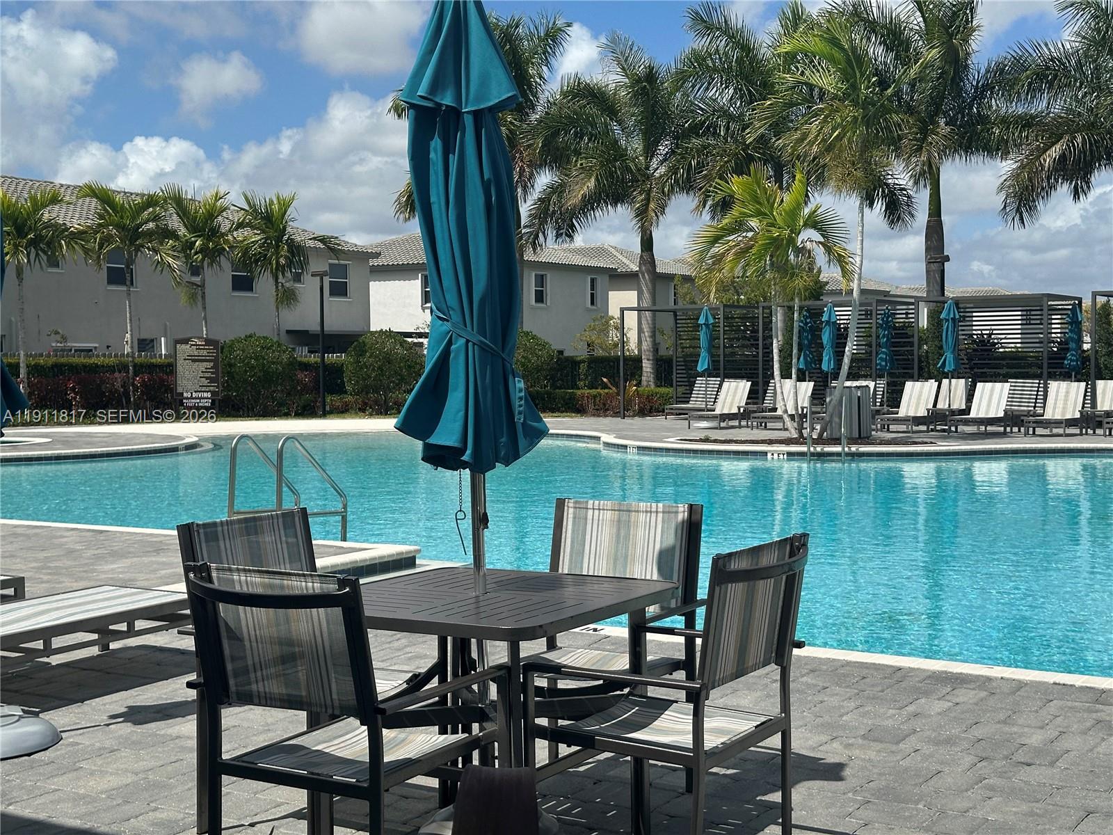 1884 Southeast 27th Street Homestead, FL 33035 - Photo 34 of 34 a view of a chairs and table in patio