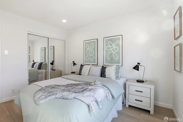 a bedroom with a bed and a view of bathroom