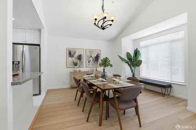 a view of a dining room with furniture and window