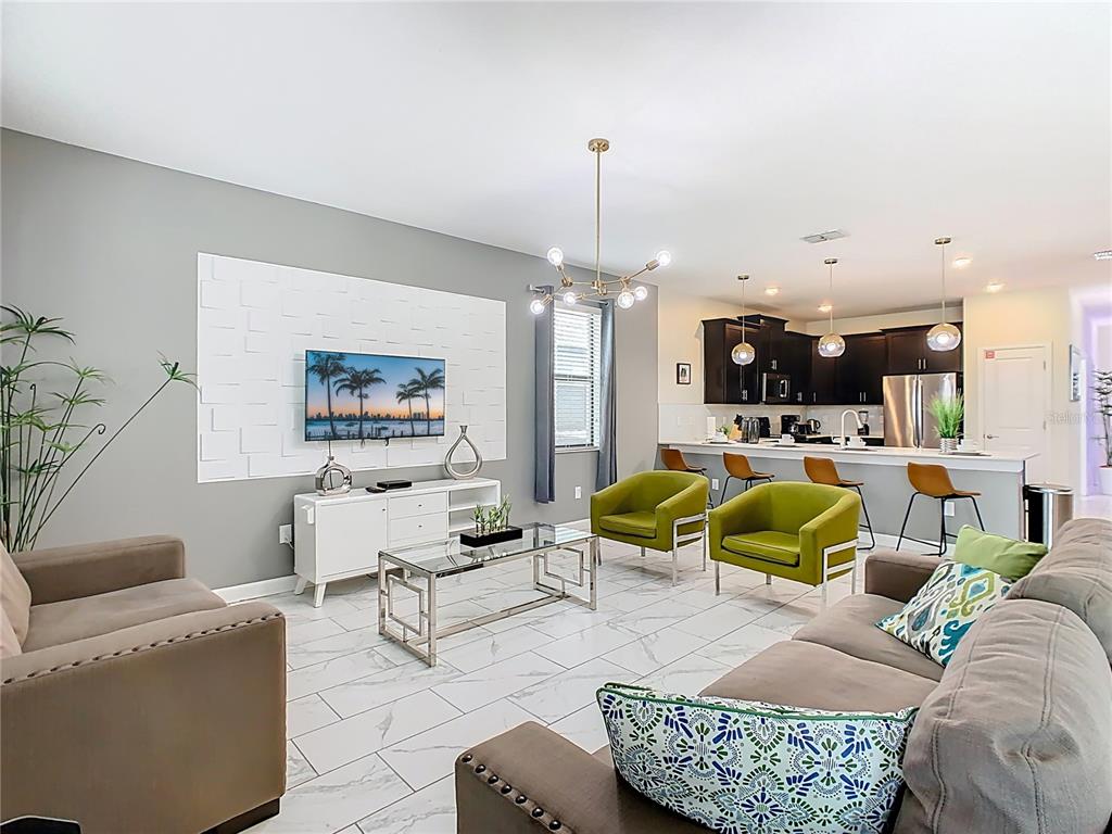 2925 Fable Street Kissimmee, FL 34746 - Photo 14 of 56 a living room with furniture and kitchen view