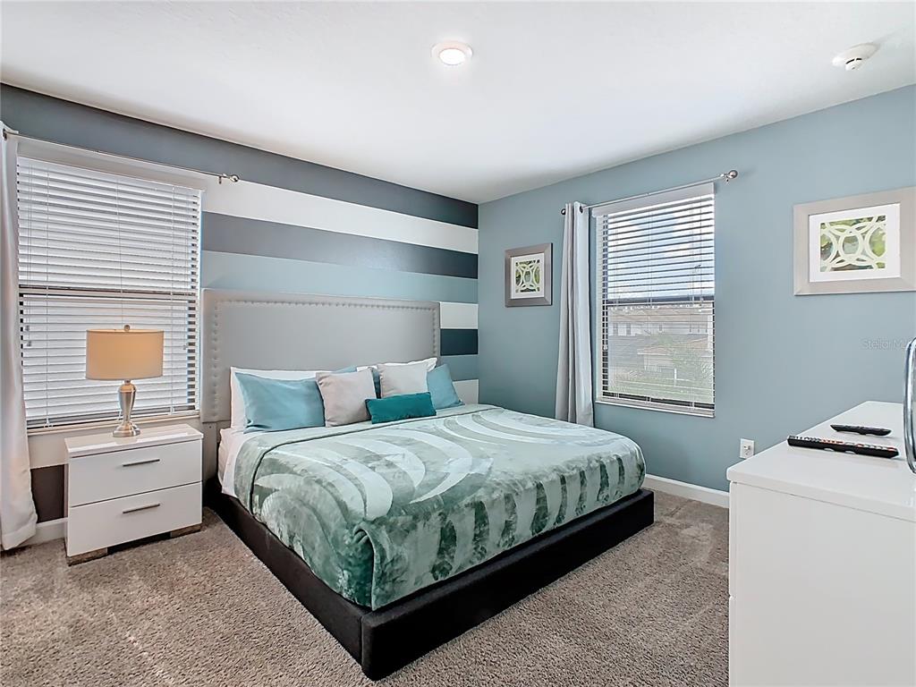 2925 Fable Street Kissimmee, FL 34746 - Photo 21 of 56 a bedroom with a bed and a window