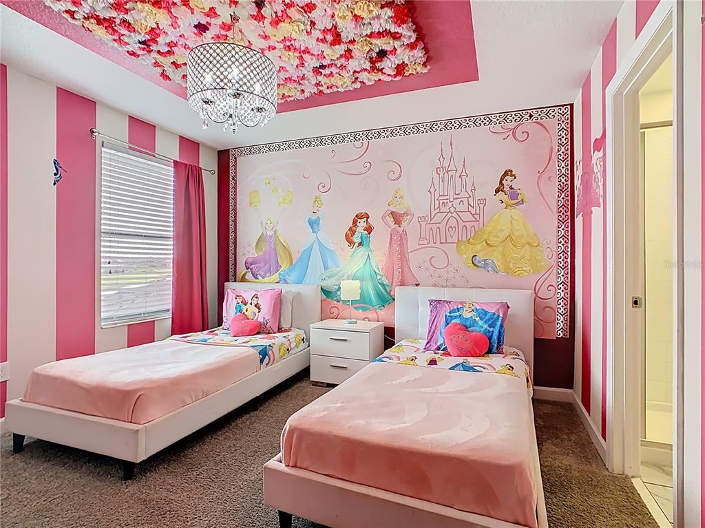 2925 Fable Street Kissimmee, FL 34746 - Photo 26 of 56 a bedroom with 2 bed and a painting on the wall