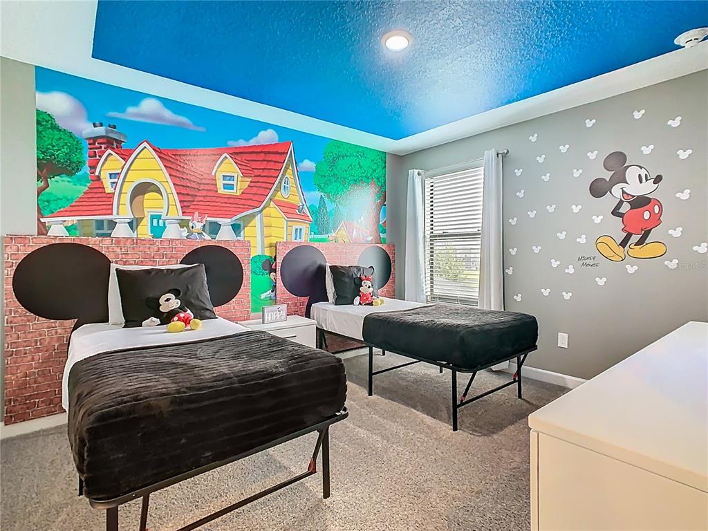 2925 Fable Street Kissimmee, FL 34746 - Photo 29 of 56 a bedroom with a bed and dresser