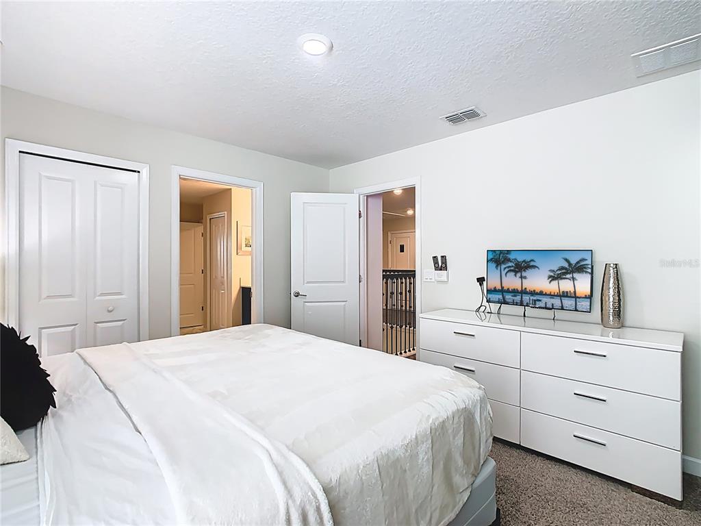 2925 Fable Street Kissimmee, FL 34746 - Photo 31 of 56 a bedroom with a bed and a dresser