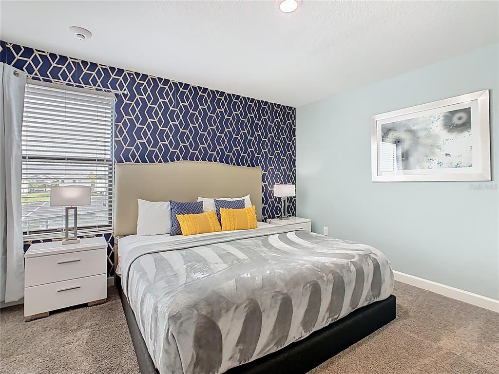 2925 Fable Street Kissimmee, FL 34746 - Photo 34 of 56 a bedroom with a bed and wooden floor