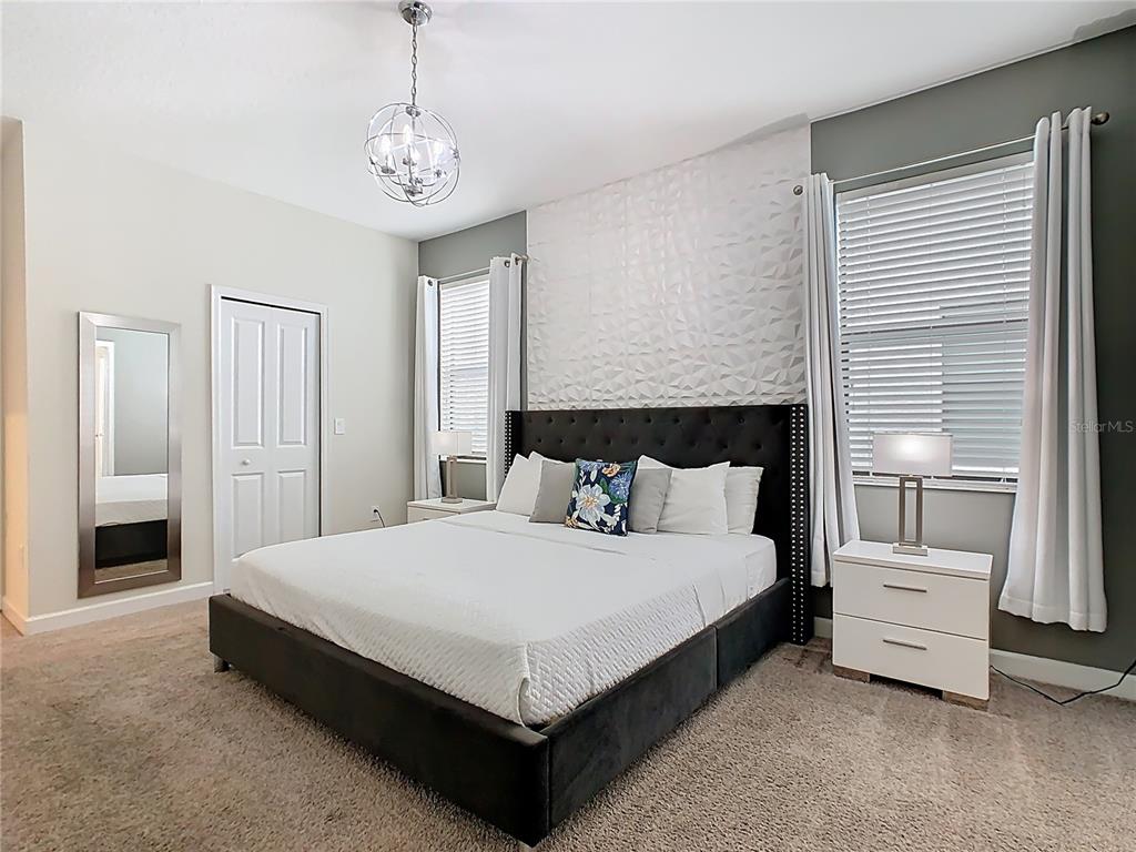2925 Fable Street Kissimmee, FL 34746 - Photo 41 of 56 a large bedroom with bed and a window