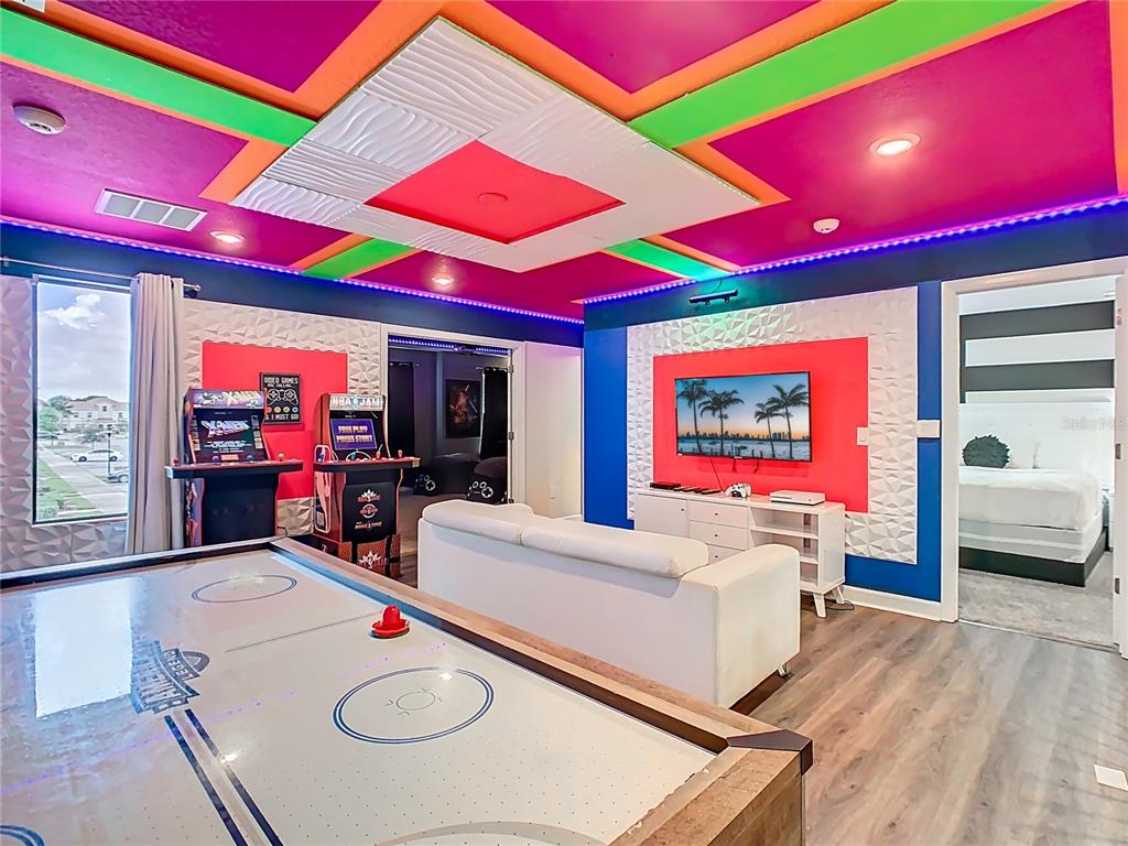 2925 Fable Street Kissimmee, FL 34746 - Photo 6 of 56 a room with furniture and a flat screen tv