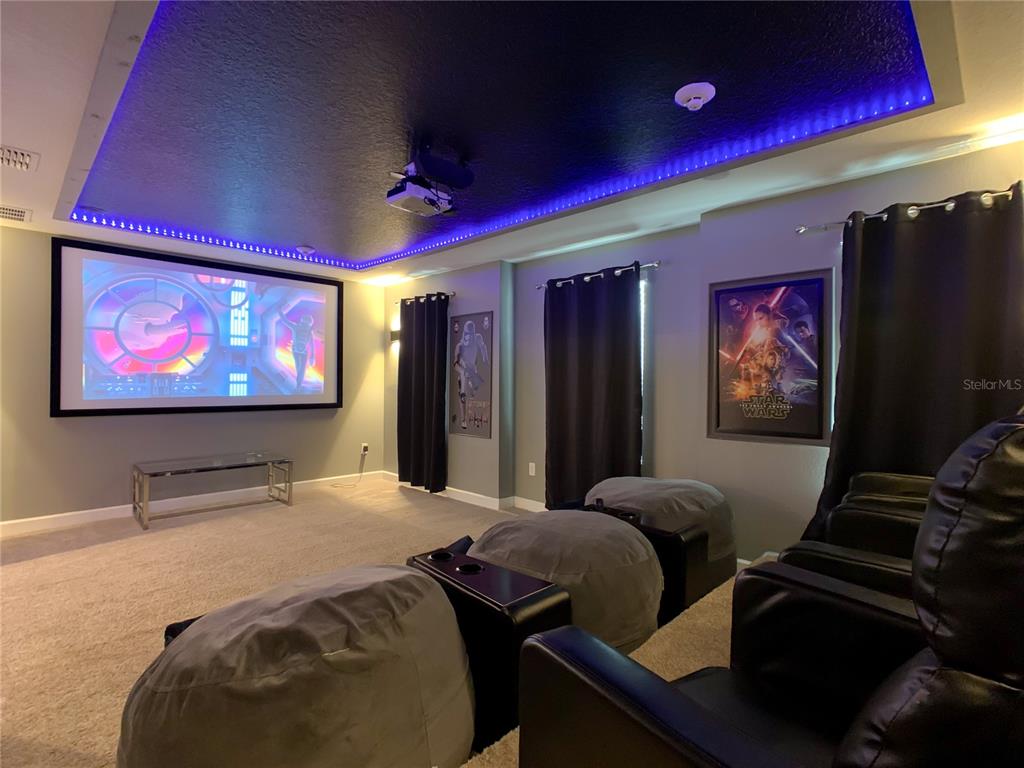 2925 Fable Street Kissimmee, FL 34746 - Photo 7 of 56 a room with furniture projector and screen