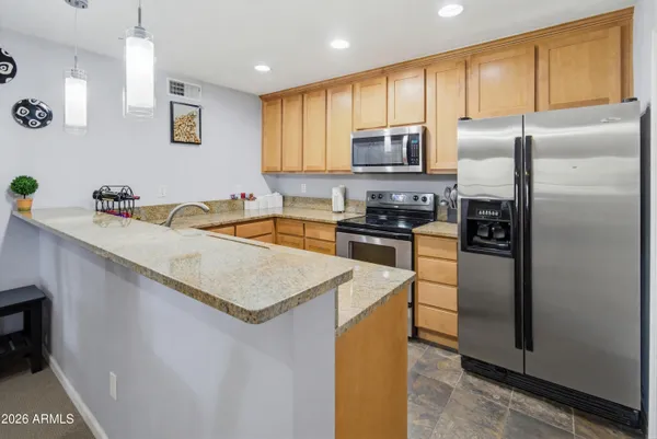 a bedroom with a bed couch and window