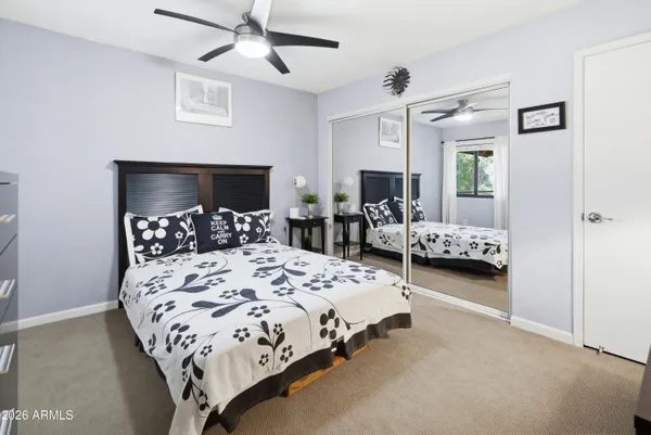 a bedroom with a bed and a dresser