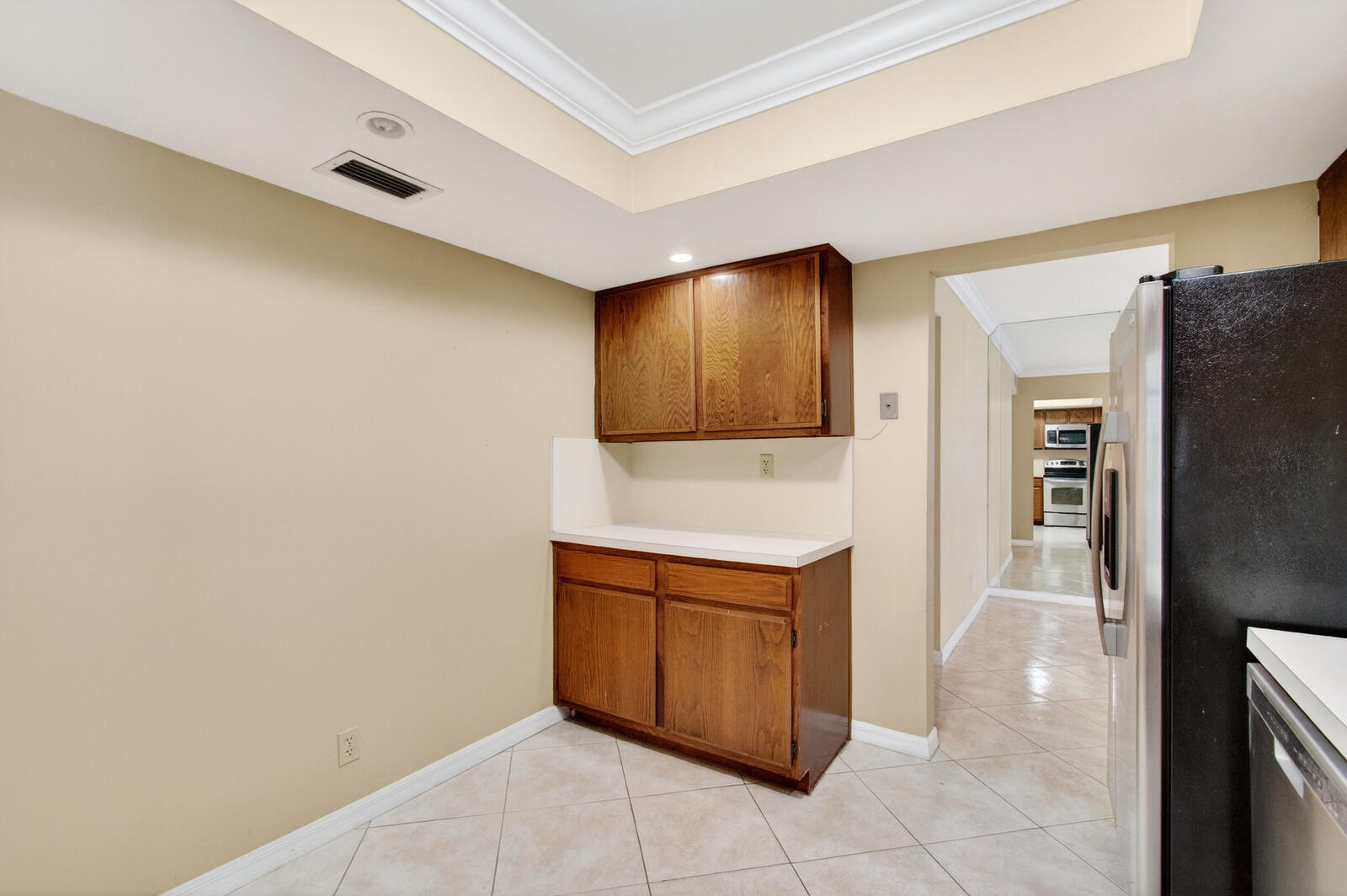 3951 Northeast 19th Road, Unit 1701 Pompano Beach, FL 33064 - Photo 38 of 82 a view of cabinets with wooden floor