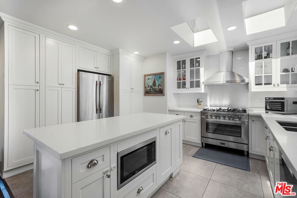 458 Rustic Drive Los Angeles, CA 90065 - Photo 19 of 41 a kitchen with a stove and a refrigerator