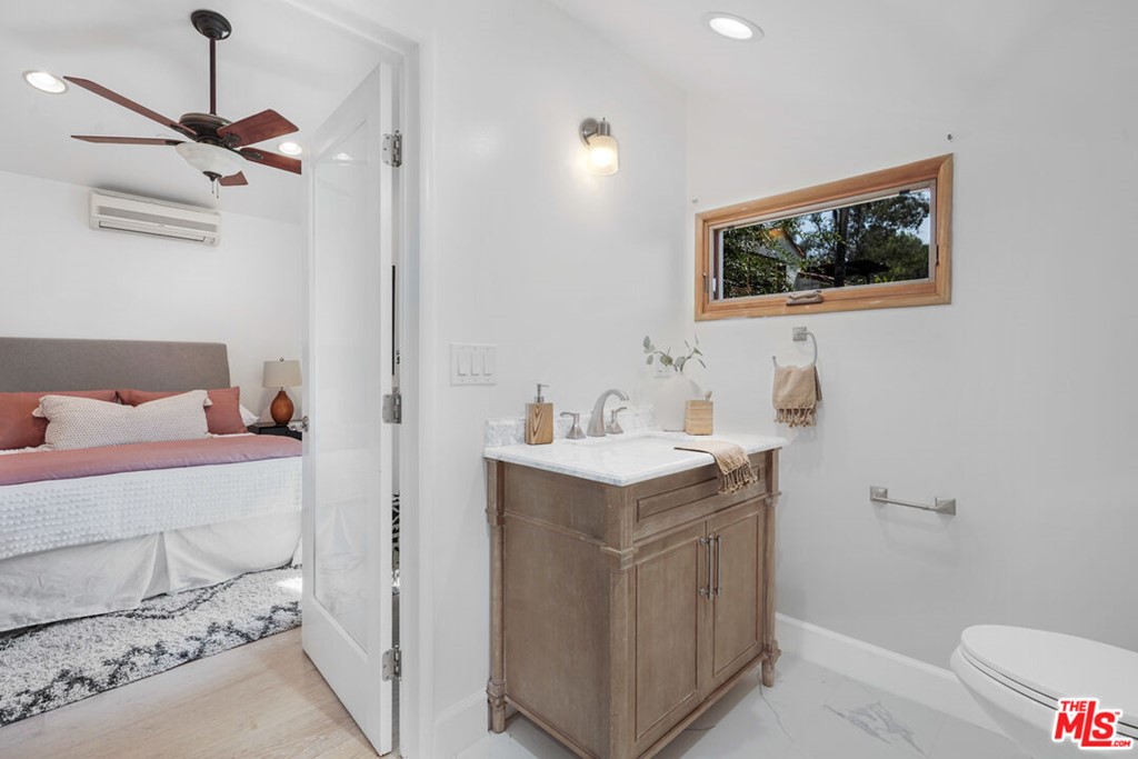 458 Rustic Drive Los Angeles, CA 90065 - Photo 27 of 41 a bathroom with a sink vanity and toilet