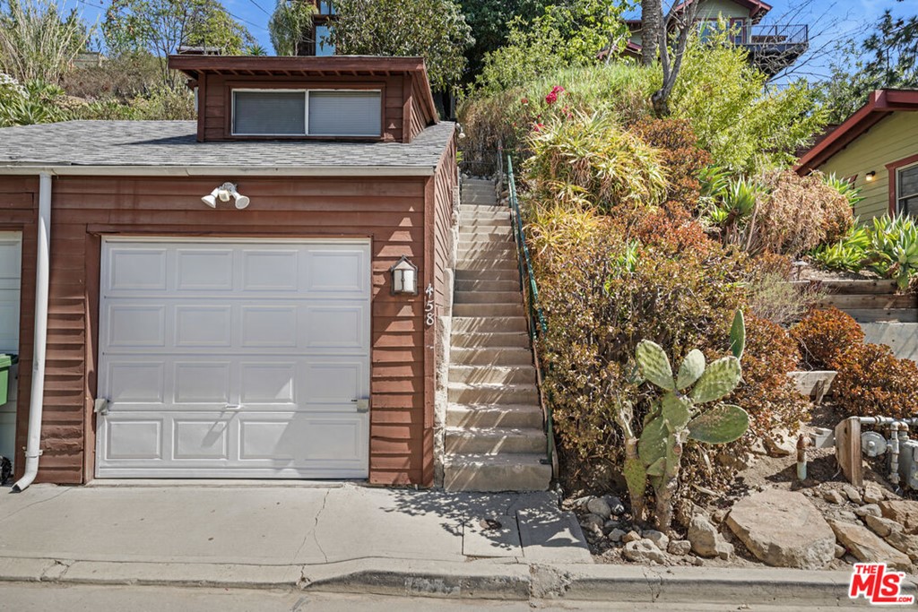 458 Rustic Drive Los Angeles, CA 90065 - Photo 29 of 41 a front view of a house with a yard