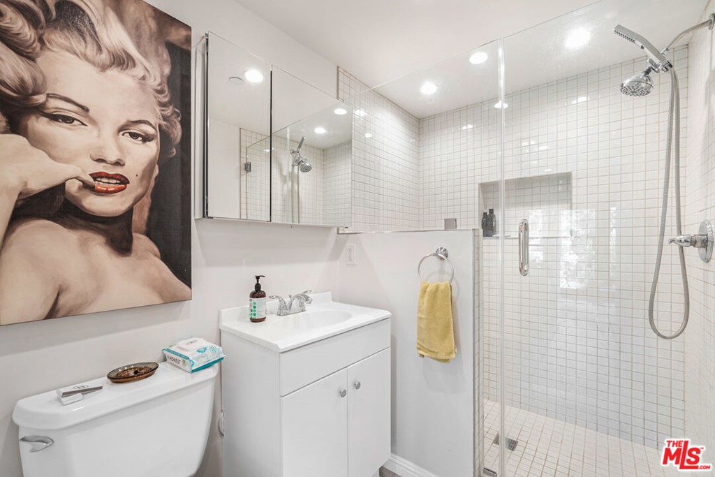 458 Rustic Drive Los Angeles, CA 90065 - Photo 33 of 41 a bathroom with a sink a toilet and shower