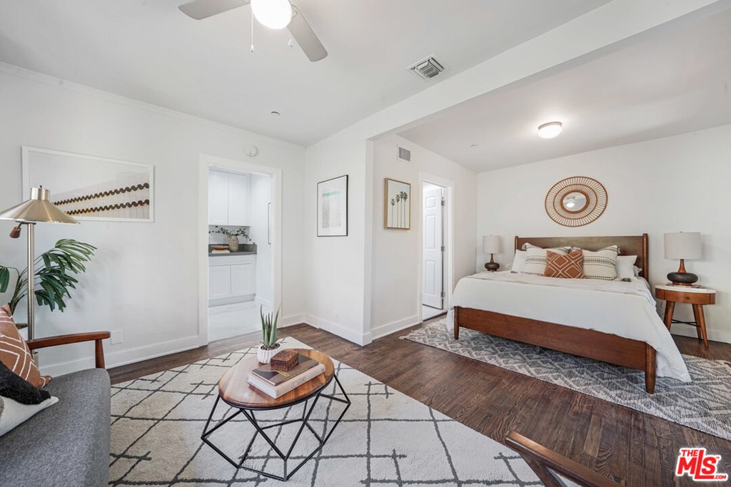 458 Rustic Drive Los Angeles, CA 90065 - Photo 38 of 41 a bedroom with a bed and ceiling fan