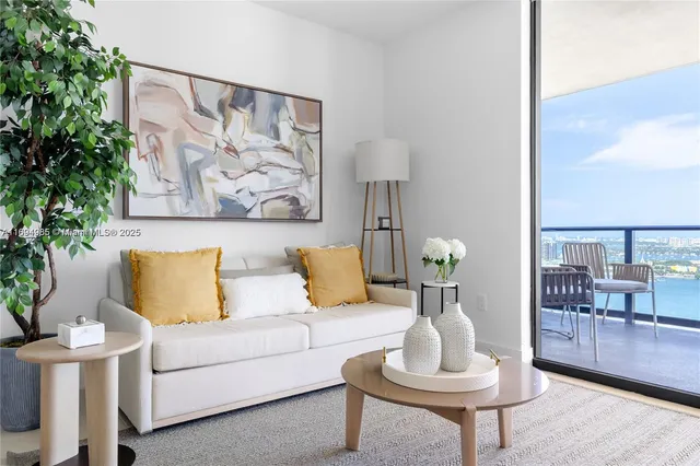 a living room with furniture and a painting