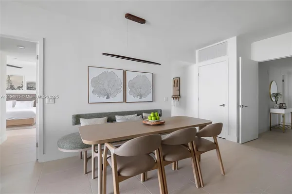 a view of a dining room with furniture and a table