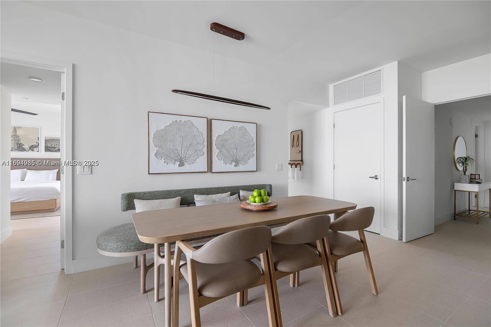159 Northeast 6th Street, Unit 2916 Miami, FL 33132 - Photo 16 of 44 a view of a dining room with furniture and a table
