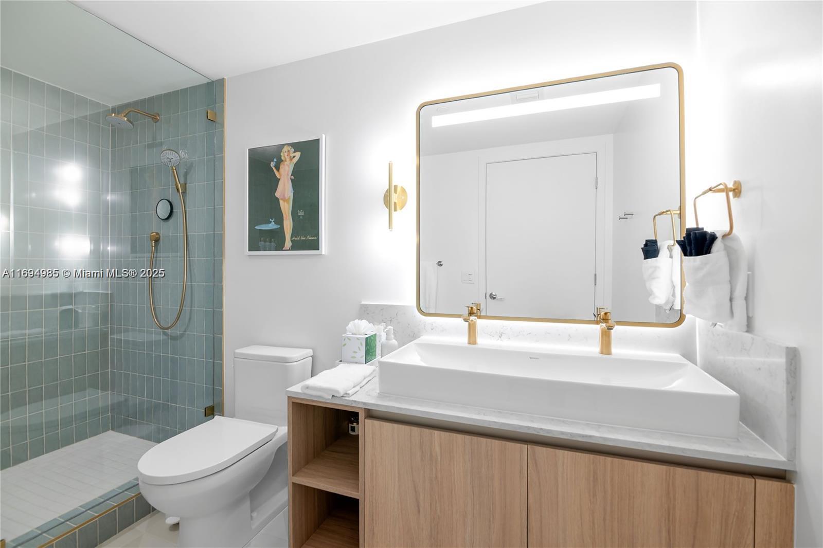 159 Northeast 6th Street, Unit 2916 Miami, FL 33132 - Photo 18 of 44 a bathroom with a sink and a toilet