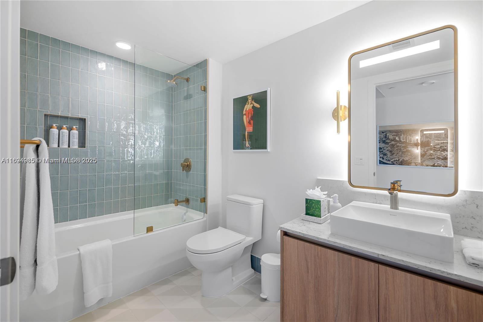 159 Northeast 6th Street, Unit 2916 Miami, FL 33132 - Photo 25 of 44 a bathroom with a sink a toilet and shower