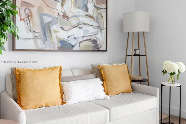 a bedroom with a bed and a lamp on table