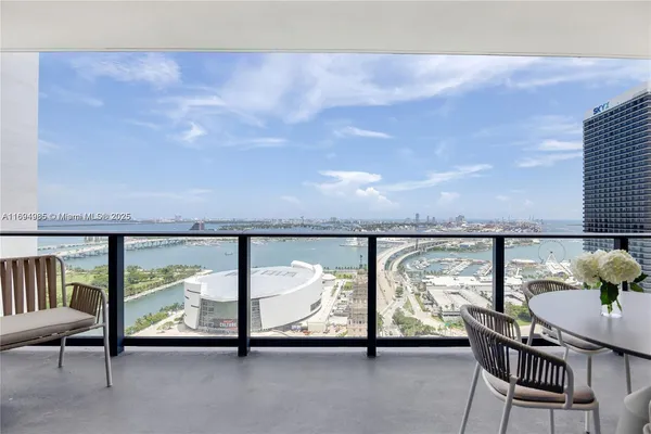 a view of a dining room with furniture window and outside view