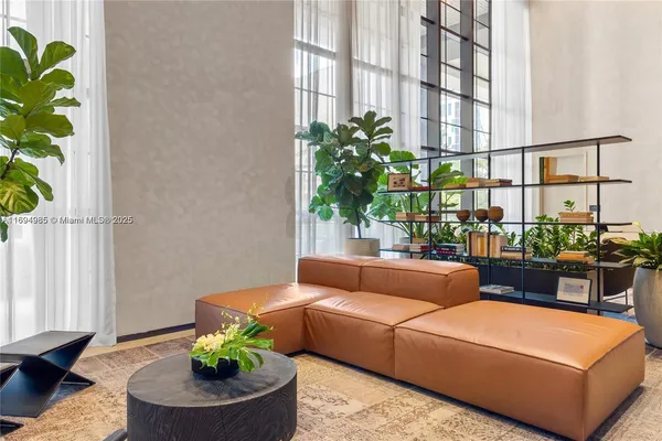 a view of a chairs and table in the balcony