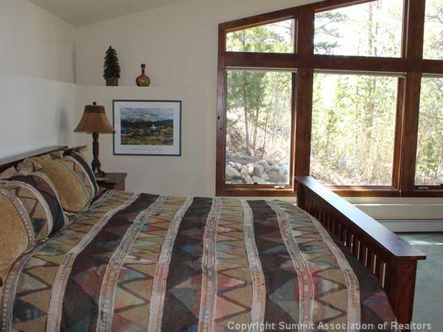 576 Moonstone Road Breckenridge, CO 80424 - Photo 17 of 22 a bedroom with a bed and a large window