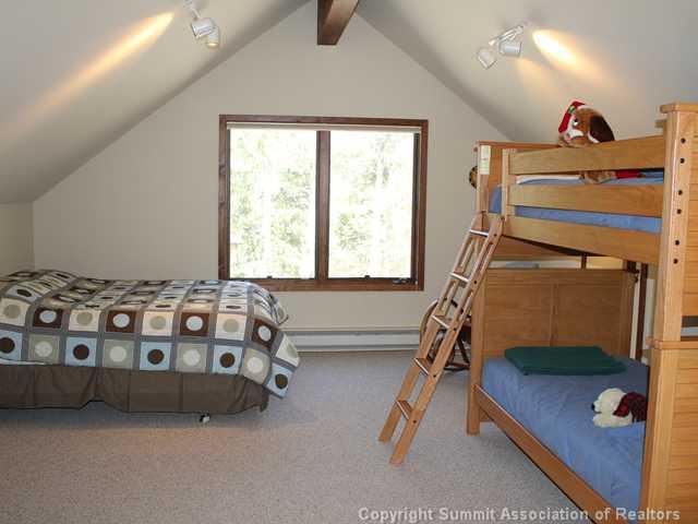 576 Moonstone Road Breckenridge, CO 80424 - Photo 21 of 22 a bedroom with a bed and a window
