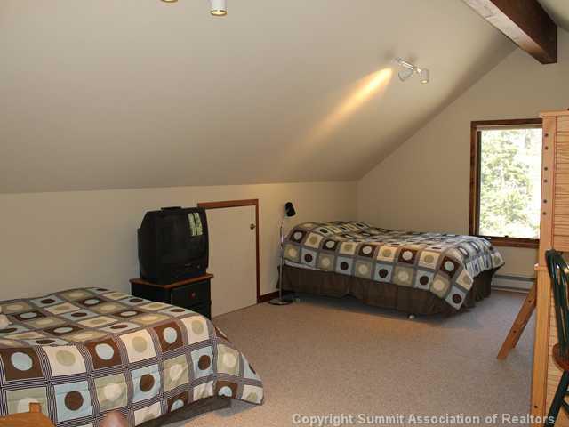 576 Moonstone Road Breckenridge, CO 80424 - Photo 22 of 22 a bedroom with a bed and window
