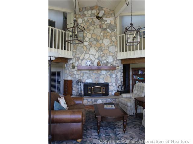 576 Moonstone Road Breckenridge, CO 80424 - Photo 7 of 22 a living room with furniture and a fireplace