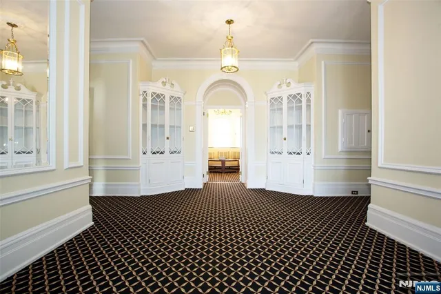 a view of a hallway with entryway door
