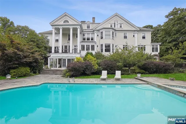 a view of a swimming pool and lounge chair