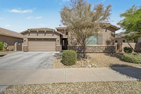 a front view of a house with garage