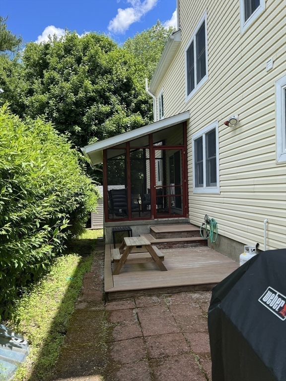 11 Garrison Road, Unit 1 Arlington, MA 02474 - Photo 21 of 42 a view of house with backyard outdoor seating and green space