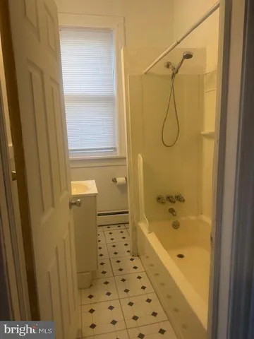 a bathroom with a shower and a bathtub