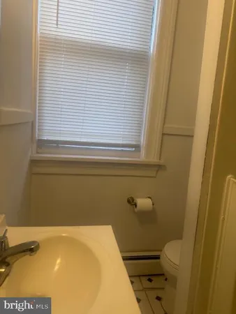 a bathroom with a sink and a toilet