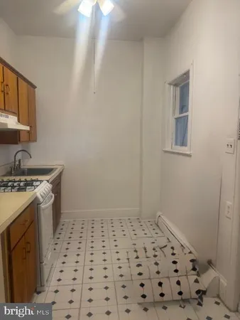 a bathroom with a sink a vanity and a shower
