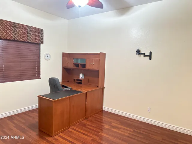 a room with cabinets and wooden floor