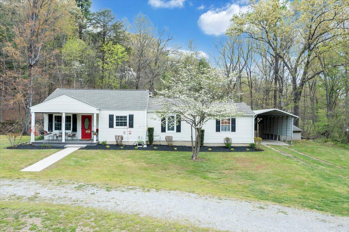 4099 Daugherty Road Salem, VA 24153 - Photo 39 of 45 a front view of a house with a garden and trees