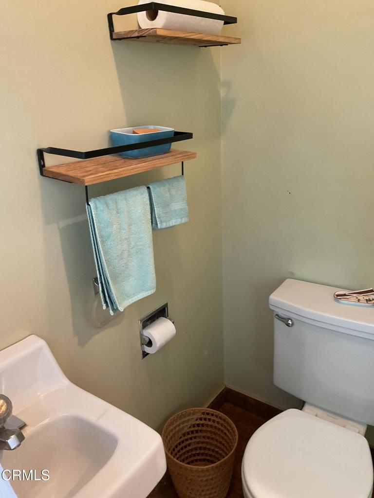31400 Sherwood Road Fort Bragg, CA 95437 - Photo 40 of 55 a bathroom with a toilet a sink and mirror